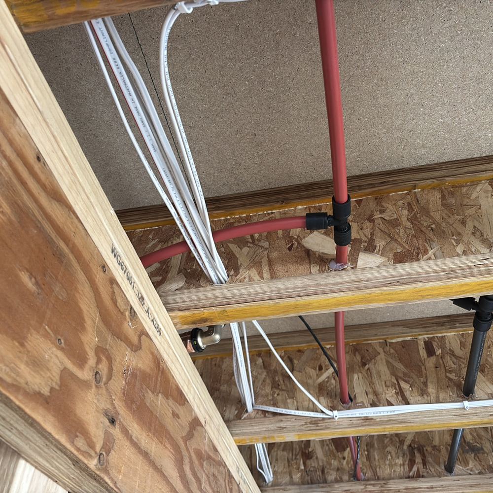 Cables resting on hot water pipes inside the frame instead of 25mm apart, Kalkallo