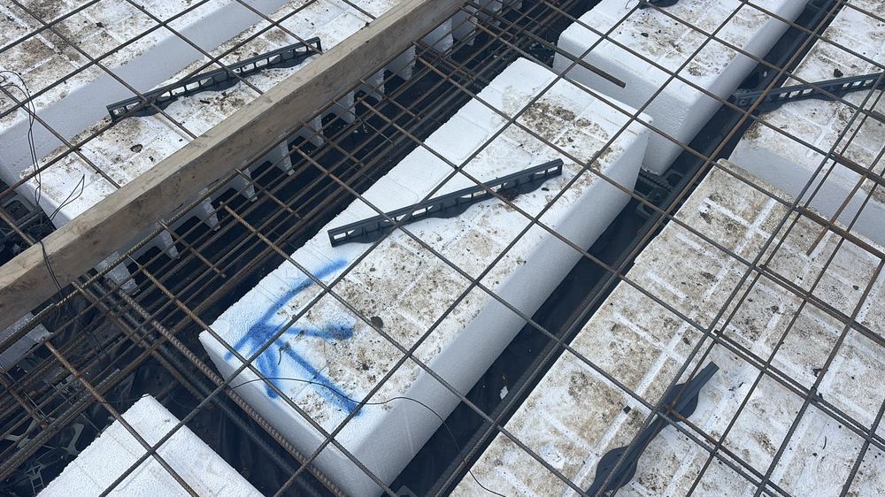 Waffle pods loose and unfixed, so beam widths could shift during the pour, found during a slab pre-pour inspection in Kalkallo